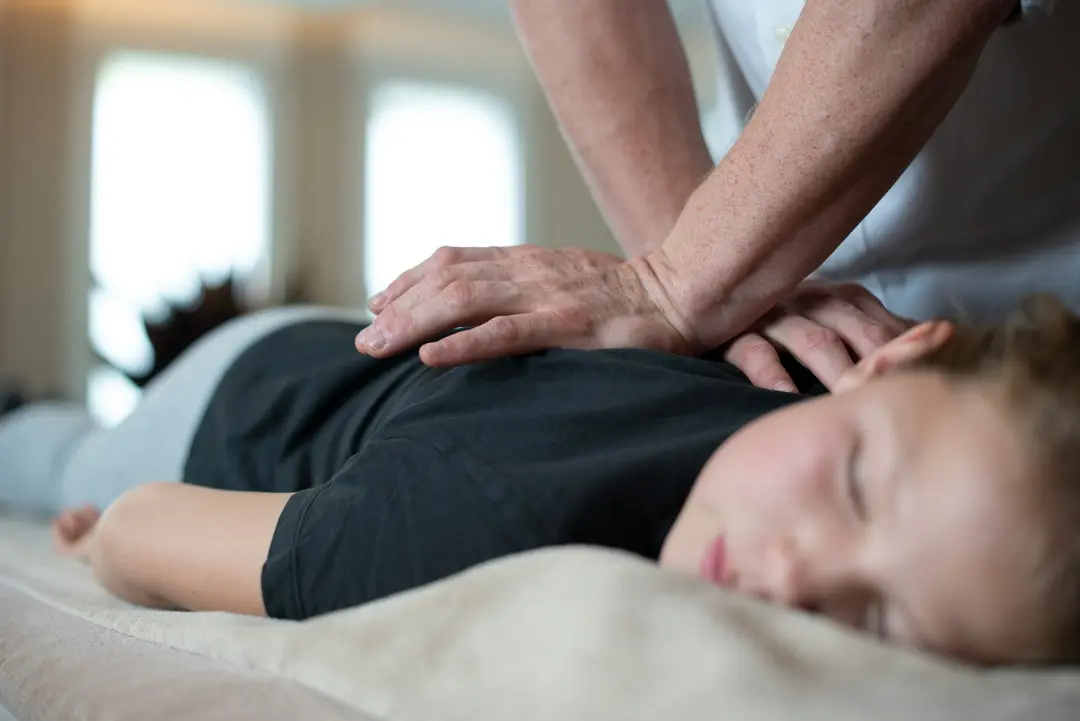 Therapist providing hands-on back treatment